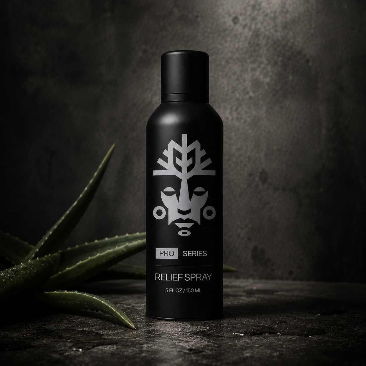 VitaliTree Pro Series Relief Spray beside a fresh-cut aloe vera leaf on dark stone
