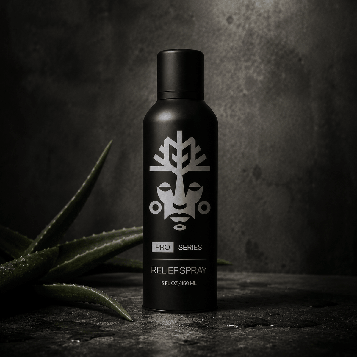 VitaliTree Pro Series Relief Spray beside a fresh-cut aloe vera leaf on dark stone