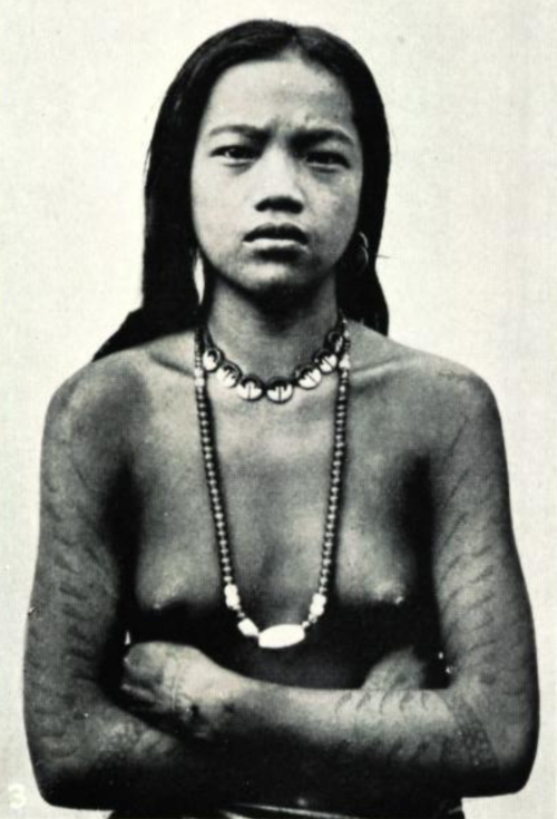 Young Ifugao woman from Banaue with traditional fern-leaf tattoos, photographed 1906
