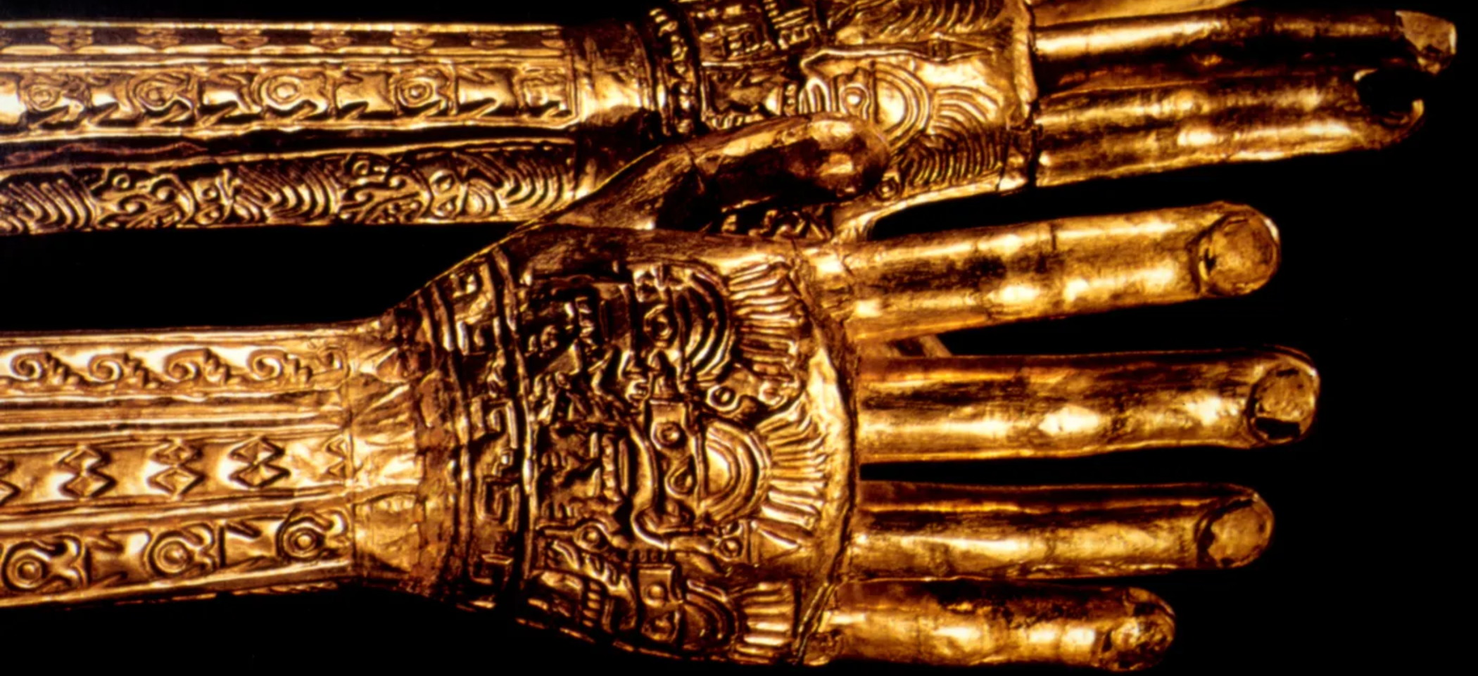 Ancient Moche gold hands artifact with tattoo-like markings from pre-Columbian Peru
